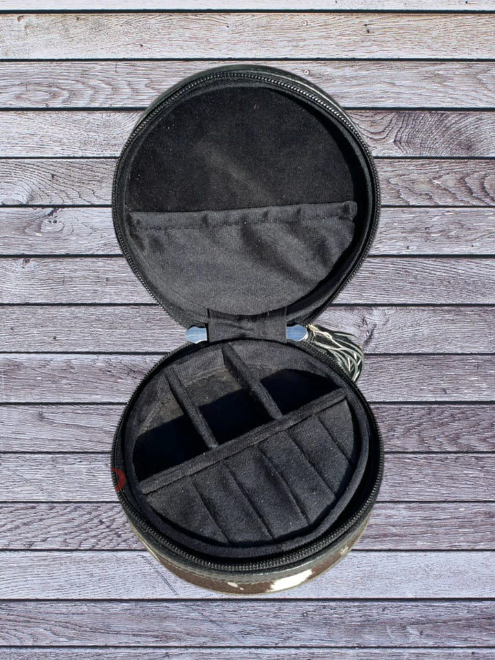 Open top view round black cowhide jewelry box