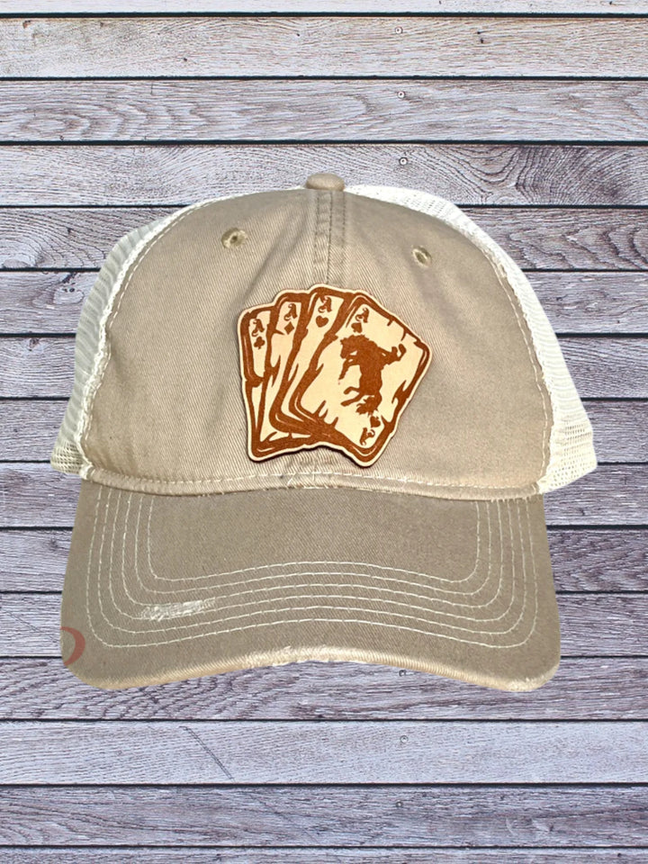 Ball cap with leather hat patch featuring Aces with bronc rider 