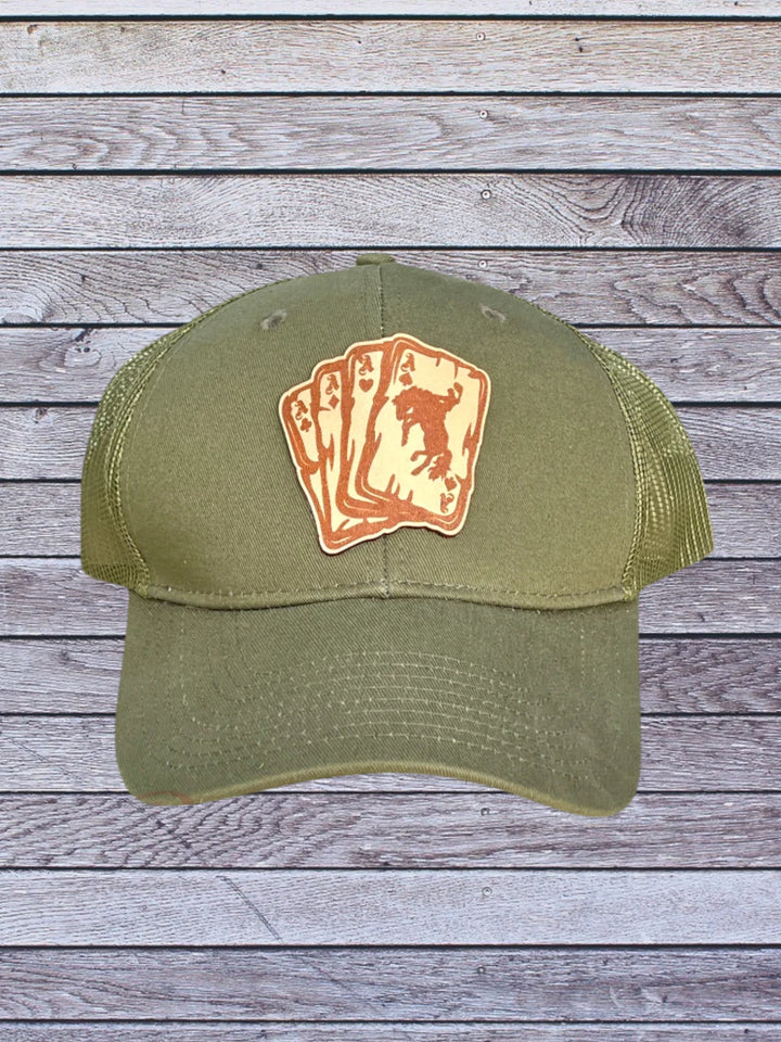 Ball cap with leather hat patch featuring Aces with bronc rider 