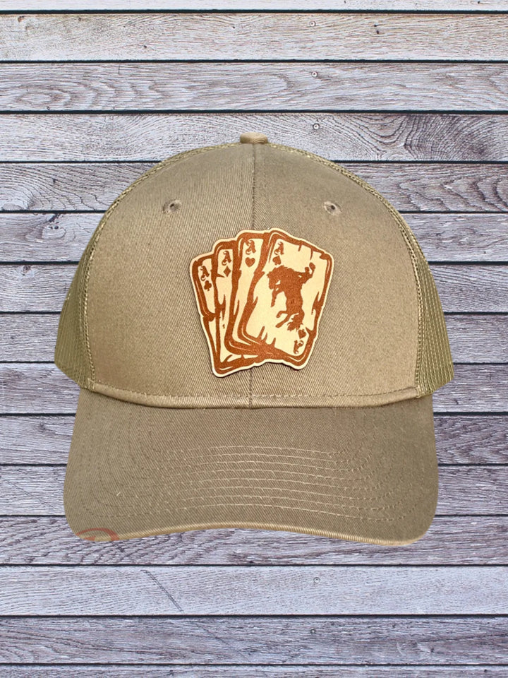 Ball cap with leather hat patch featuring Aces with bronc rider 