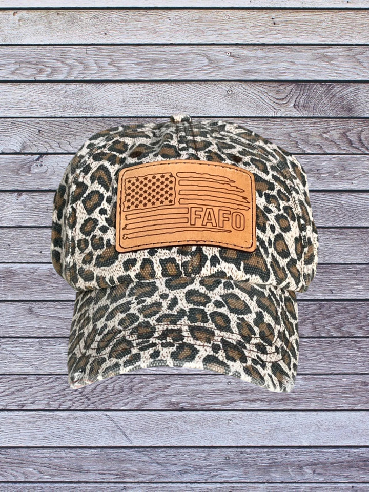 Front view of cheetah ball cap with FAFO hat patch