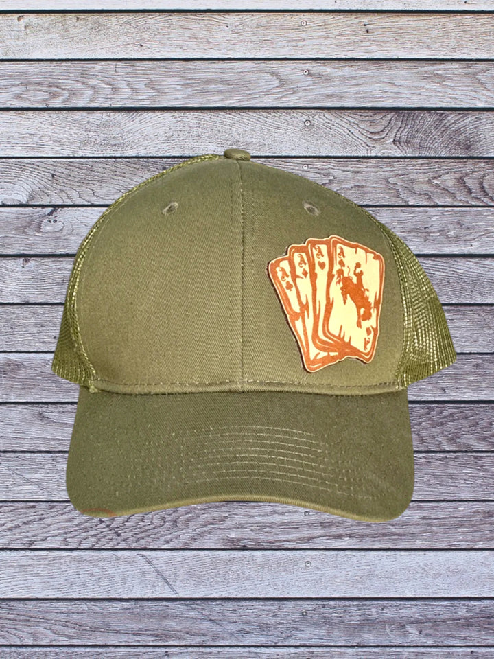 Ball cap with leather hat patch featuring Aces with bronc rider 