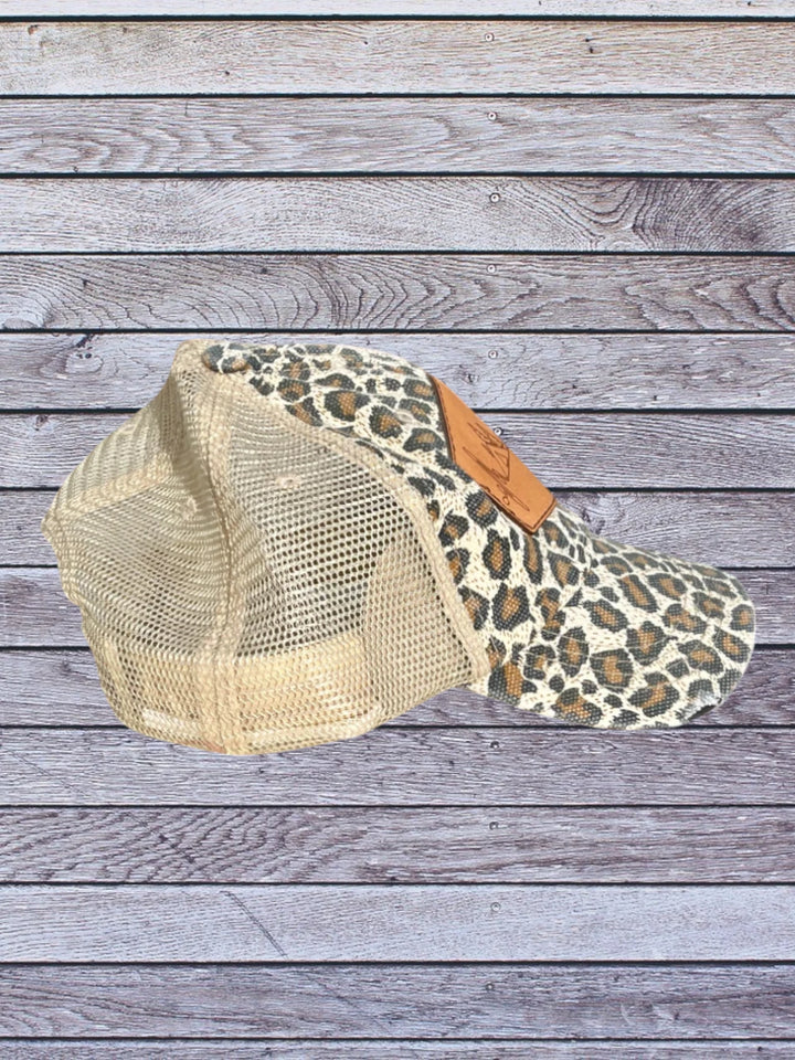 Side view of cheetah ball cap with camping hat patch