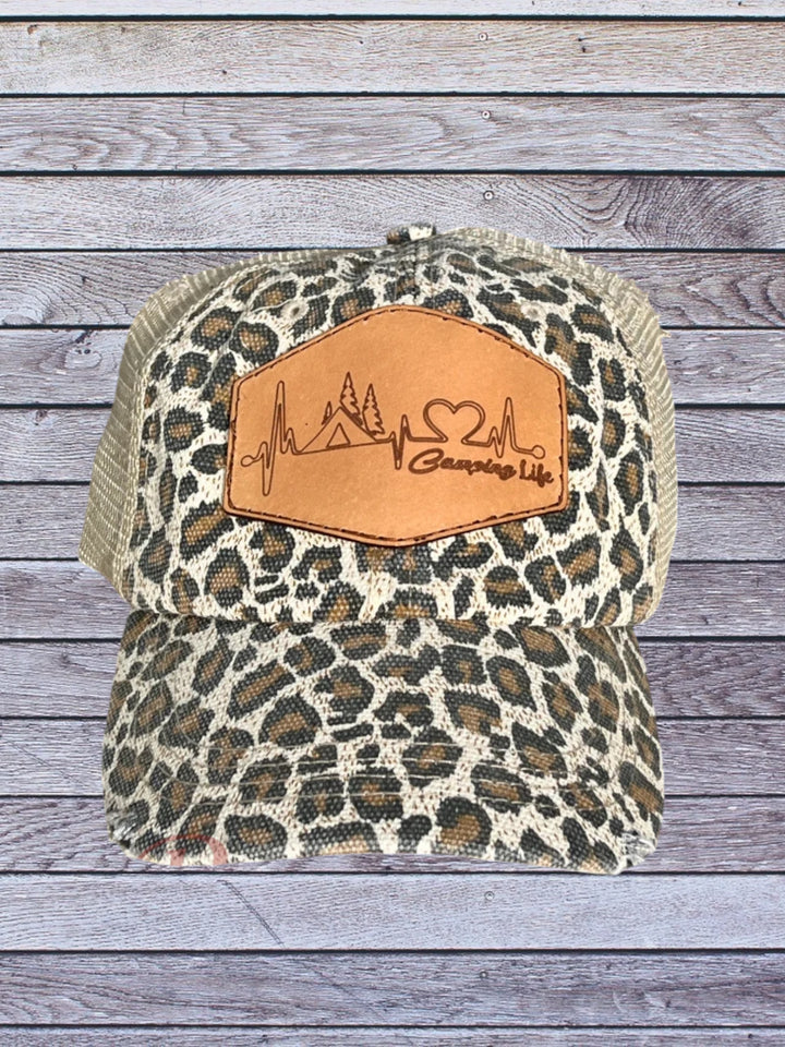 Front view of cheetah ball cap with camping hat patch