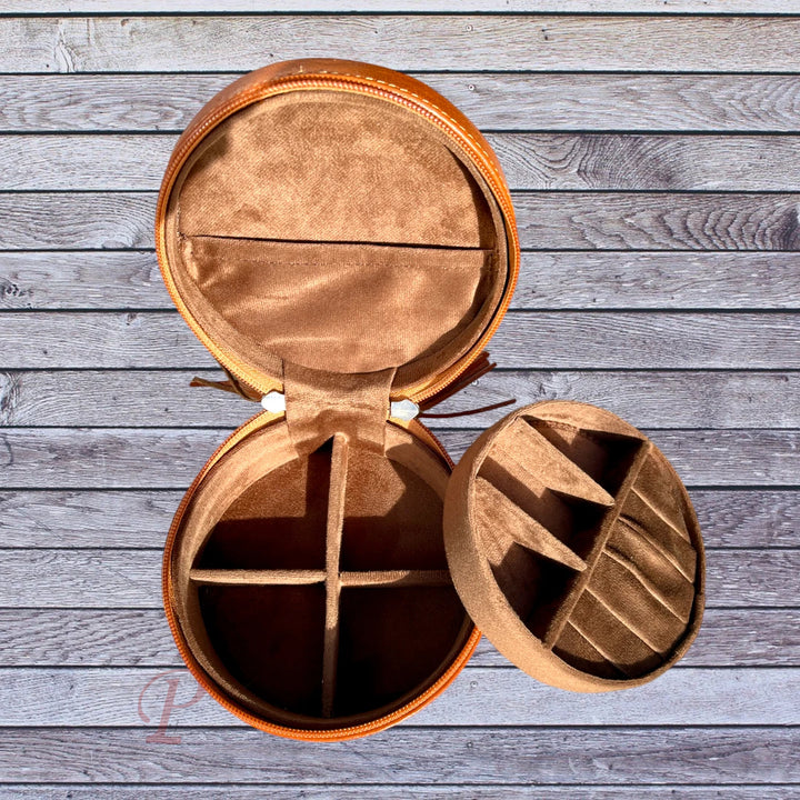 top view round brown cowhide jewelry box. second level